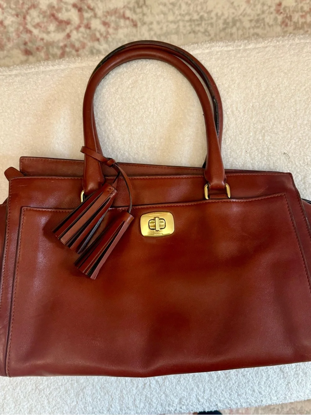 Structured Brown Leather Tote Handbag with Tassel Accent